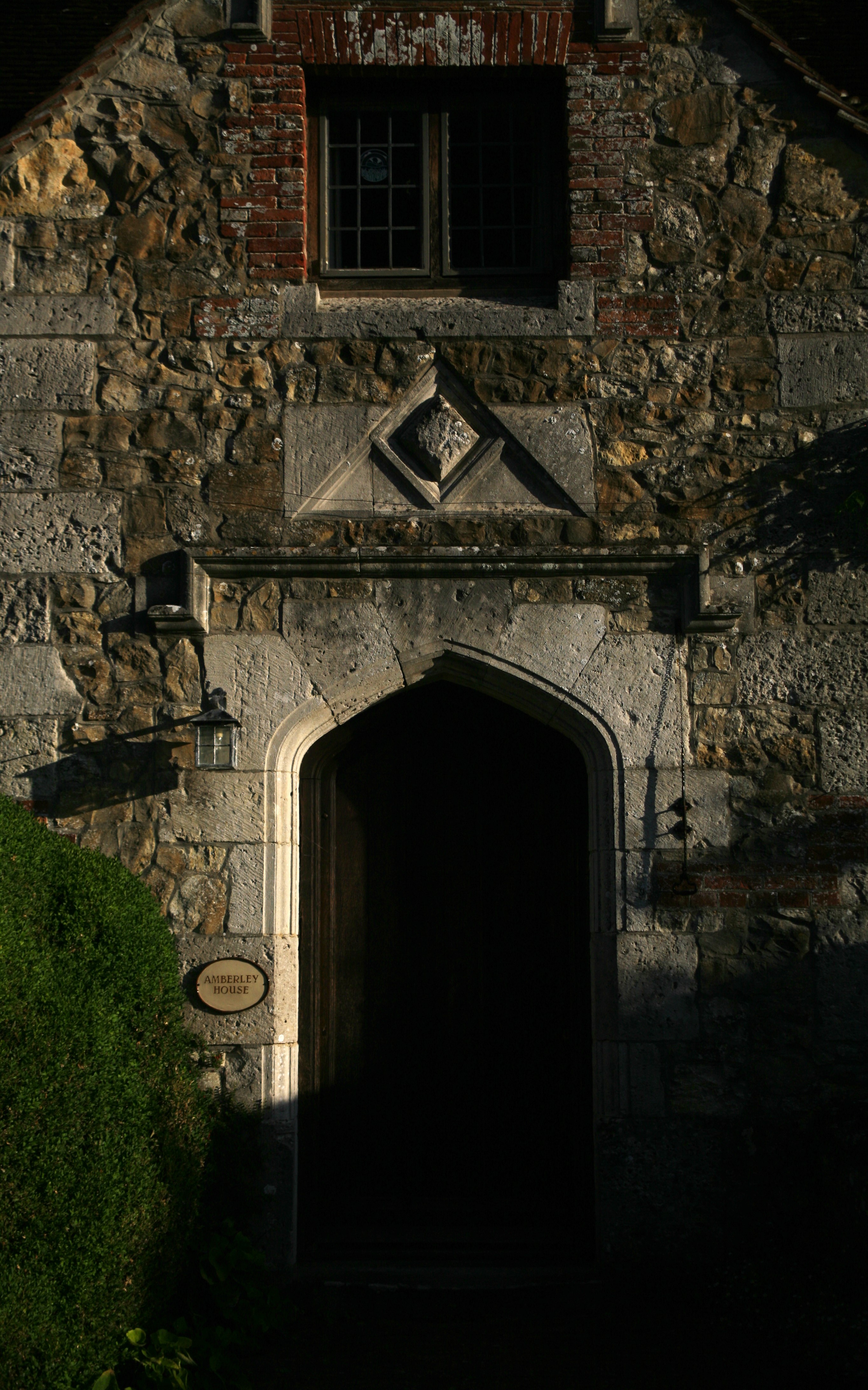 The ornate stone entryway of an old cottage